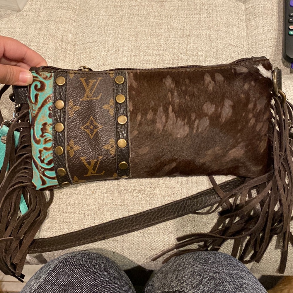 Cute LV accent brown hair on hide clutch! With a pop of turquoise!